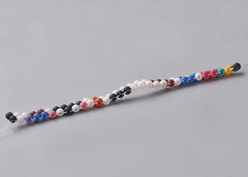 Side view of two columns of multicolored seed beads stitched together